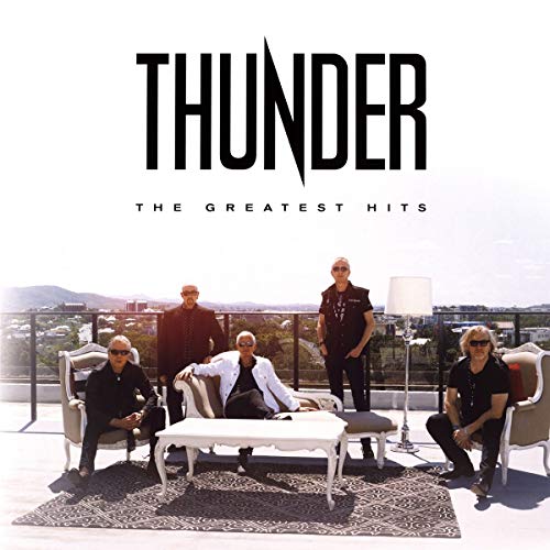 "Album cover featuring the band 'Thunder' with five members on a rooftop."