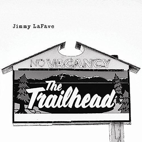 "Black and white image of a motel sign with 'The Trailhead' written on it."