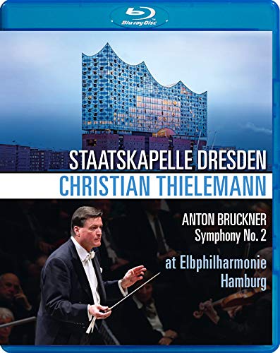 "Blu-ray case cover featuring a conductor and a modern building."
