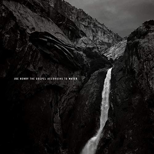 "Black and white album cover featuring a waterfall between rocky cliffs."