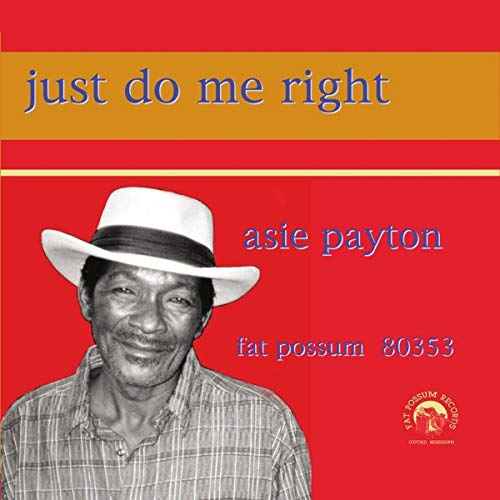 "Album cover with black and white man wearing a hat against a red background."