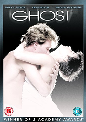 DVD cover of "Ghost" featuring a man embracing a woman, with a ghostly figure.