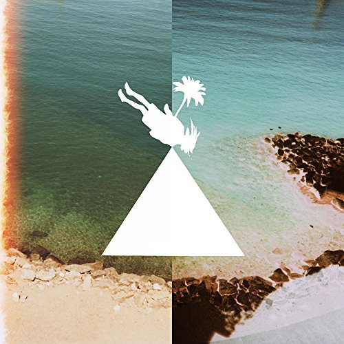 A vinyl record cover with a white triangle and diver silhouette on a beach background.