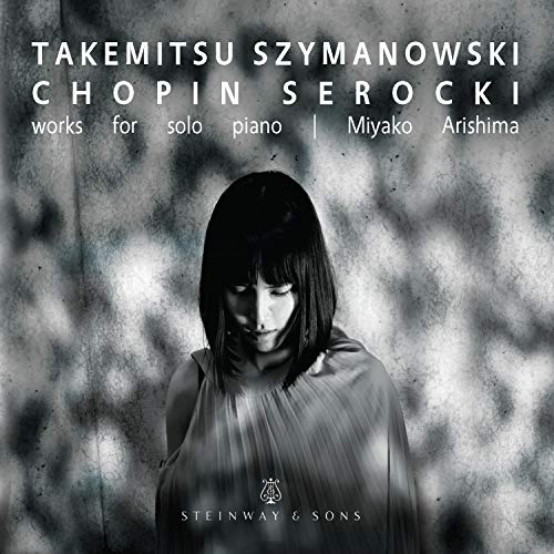 "CD cover featuring a black and white image of a woman with dark hair."