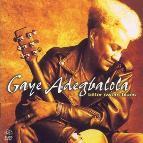 "Album cover with a woman holding a guitar, wearing a leather jacket."
