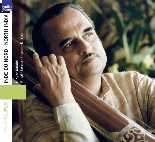Man holding a stringed instrument, wearing a beige shirt, with text on the left.
