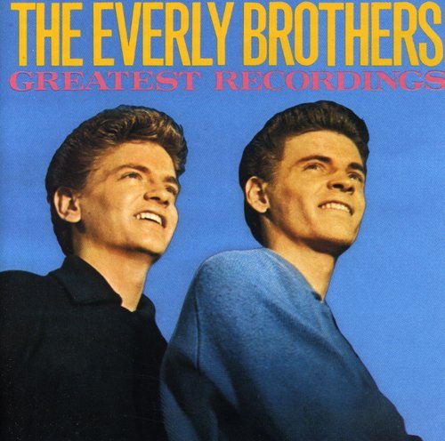 "Album cover featuring The Everly Brothers against a blue background, smiling and looking upwards."