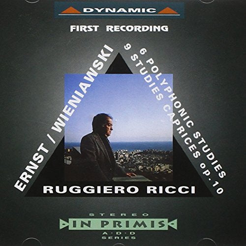 CD cover with a man standing on a balcony overlooking a cityscape.