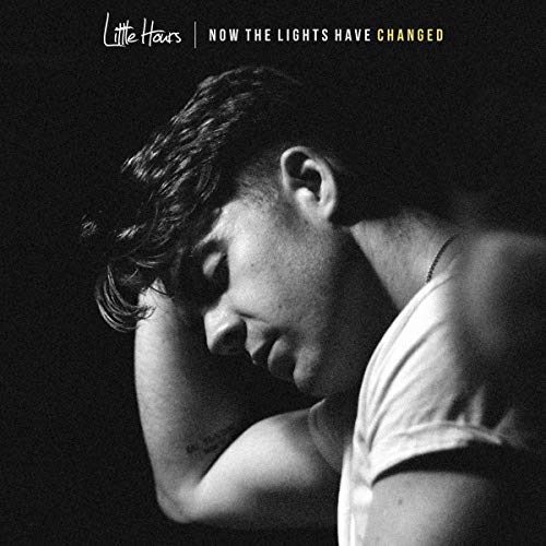 Black and white album cover featuring a man with his head resting on his arm.