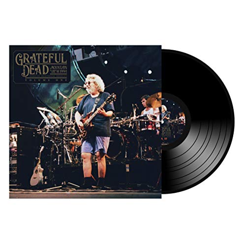 "Vinyl record with cover art of a man playing guitar on stage."