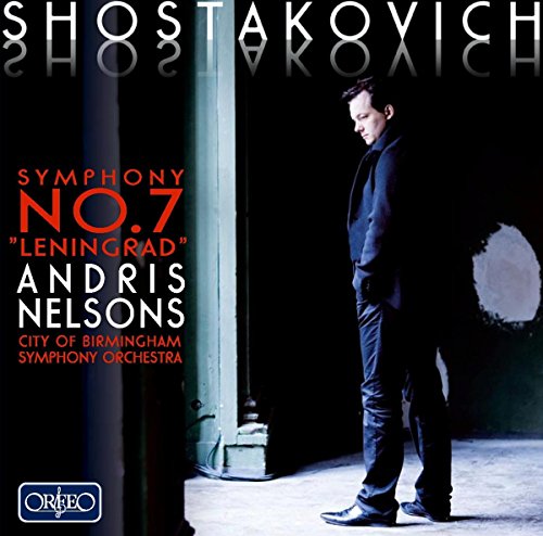 CD cover featuring a man in a dark suit standing in a dimly lit doorway.