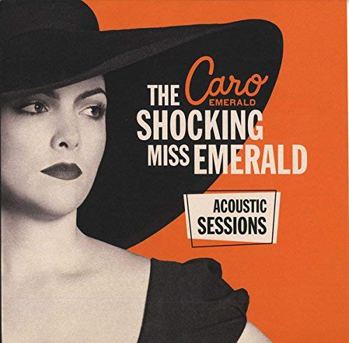 Orange vinyl record with cover featuring a woman in a black hat.