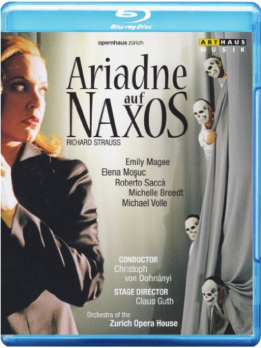 Blue-ray cover featuring a woman in black, with masked figures behind a curtain.
