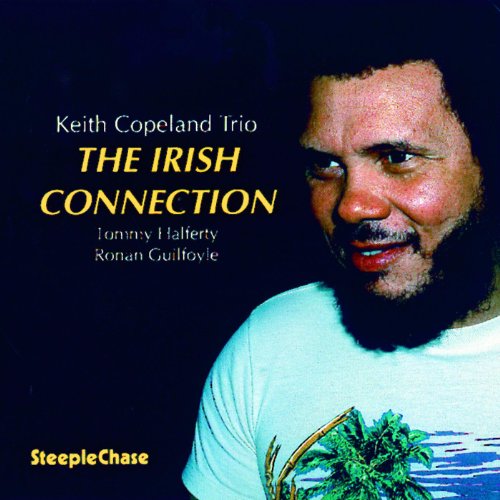 CD cover with a man in a white t-shirt against a black background.
