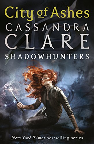 Book cover featuring a kneeling woman with flowing red hair, holding a glowing staff.