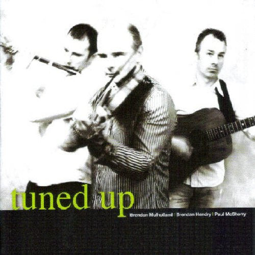 "CD cover featuring three men playing musical instruments, with 'tuned up' text."