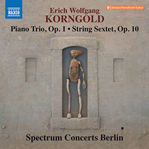 CD cover featuring a carved wooden figure in a stone niche.