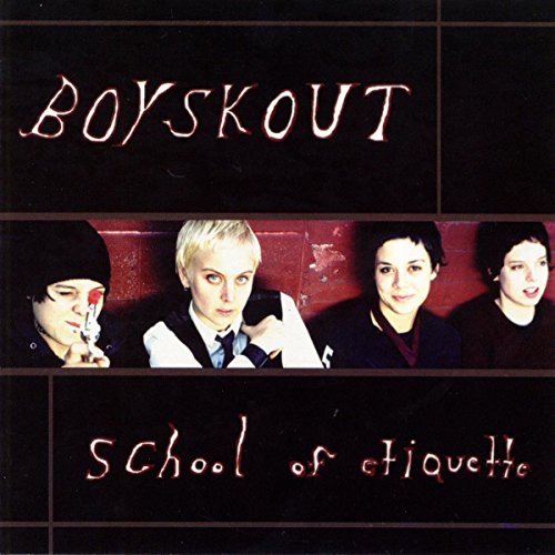 "CD cover with four men in dark clothing against a red brick wall."
