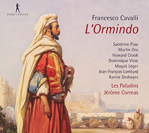 CD cover featuring a man in red robes and white headscarf, desert landscape background.
