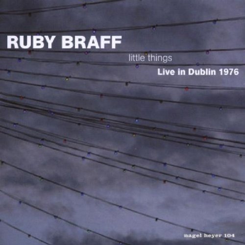 "Album cover with dark, cloudy sky and multiple power lines."
