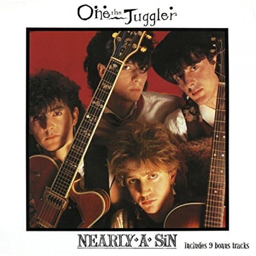"Album cover featuring four men holding guitars, with red background and white border."
