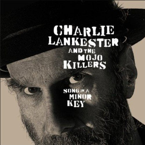 "Album cover featuring a close-up of a man's face wearing a hat."