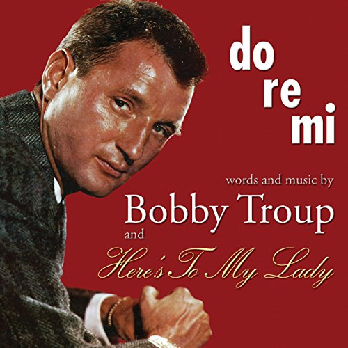 Red album cover with a man and white and gold text.