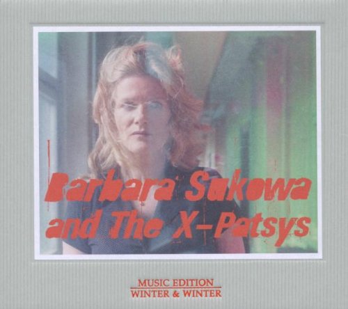 Album cover with a blonde woman and red text on a green background.