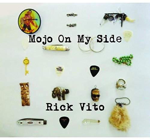 Album cover with various trinkets and title "Mojo On My Side" by Rick Vito.