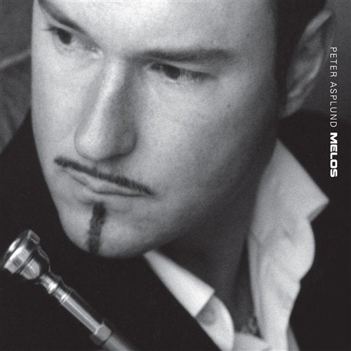 Black and white album cover featuring a close-up of a man holding a saxophone.