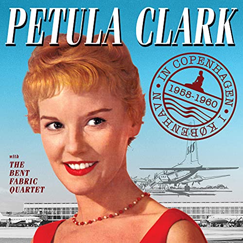 Petula Clark album cover featuring a smiling woman in red, with airport image.