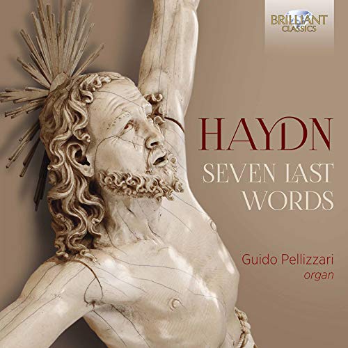 "CD cover featuring a statue of Jesus on the cross, beige background, text 'Haydn Seven Last Words'."
