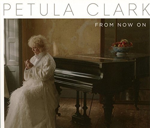 "Black and white vinyl album cover featuring a woman with curly hair."