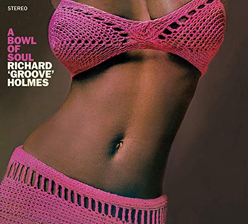 Album cover featuring a woman's torso in pink crocheted lingerie against a brown background.