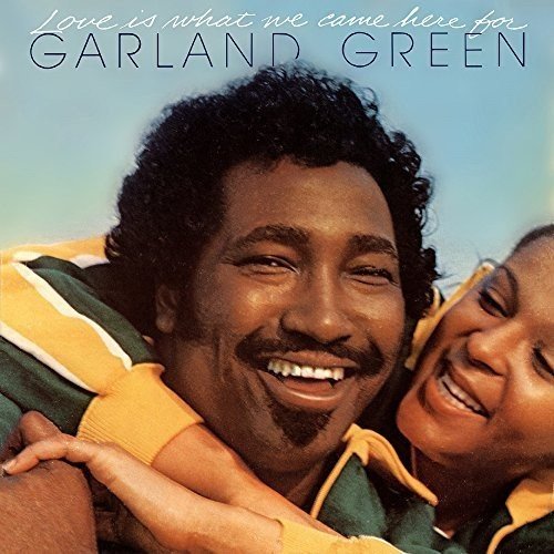 Album cover featuring a smiling man and woman in matching green and yellow shirts.