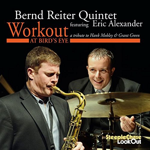 "Album cover featuring two men, one playing saxophone and the other playing cymbals."