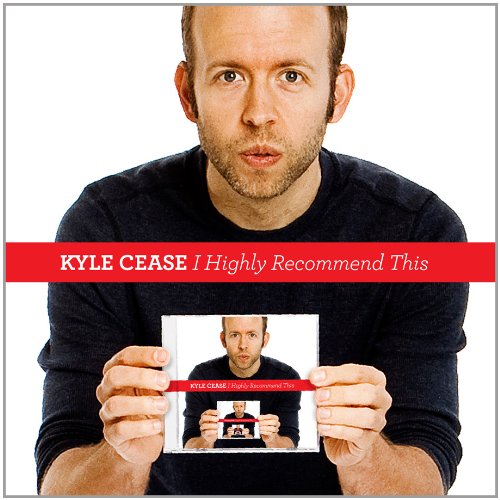The image depicts a man holding a CD titled "I Highly Recommend" by Kyle Cease. The man is wearing a black shirt and has short brown hair. He is looking directly at the camera with a neutral expression. The CD cover features the same man, creating a sense of continuity. The overall atmosphere suggests a promotional or advertising image for the CD.