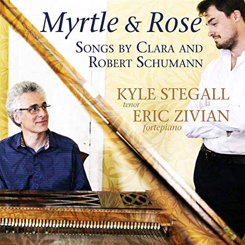 "Album cover featuring two men, one at a piano, with floral design."