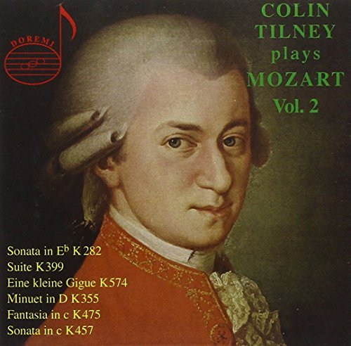 "CD cover featuring a portrait of Mozart with text listing musical compositions."