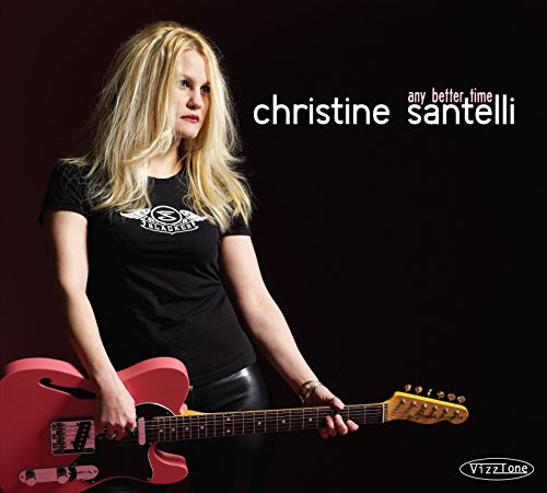 "Album cover featuring a blonde woman holding a red guitar against a dark background."