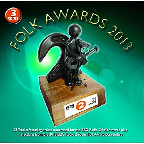 "CD cover with a black trophy on a wooden base against a green background."
