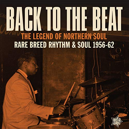 Vinyl album cover featuring a man playing drums with sepia-toned image and bold text.