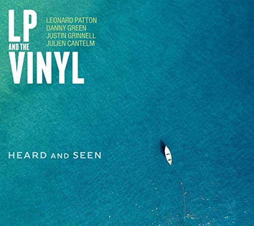 "CD cover with a small boat on a blue-green ocean background."
