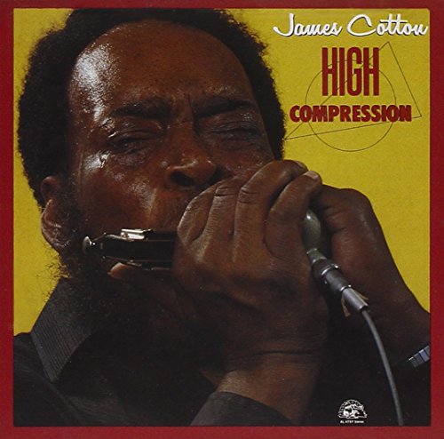 Man playing harmonica with eyes closed, on album cover with yellow and red background.
