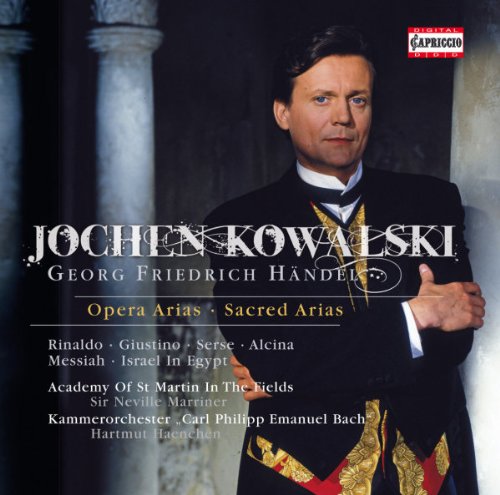 "CD cover featuring a man in a black suit with gold accents."
