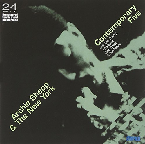 Album cover with a black background and green-toned man's profile image.