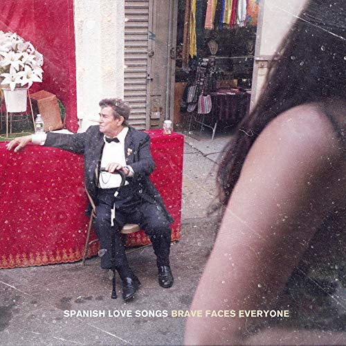 "Album cover featuring a man in a tuxedo and a woman's shoulder."