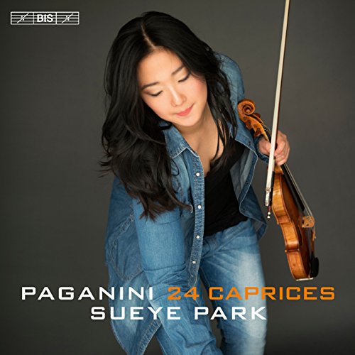 A woman with a violin against a dark grey background, album cover artwork.