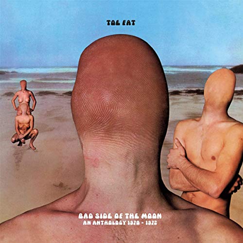 "Album cover featuring three bald, nude figures on a beach with a giant thumb."