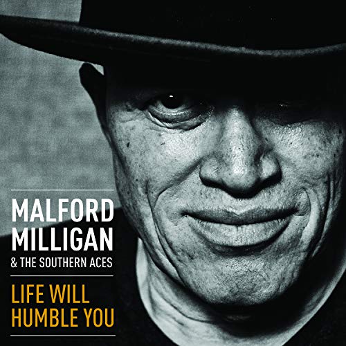 Black and white album cover with a man's face and hat, text on the left.